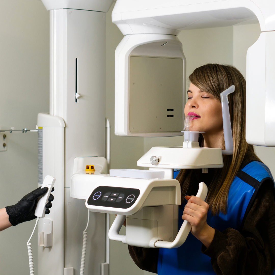 Female dental patient receiving CT cone beam scan